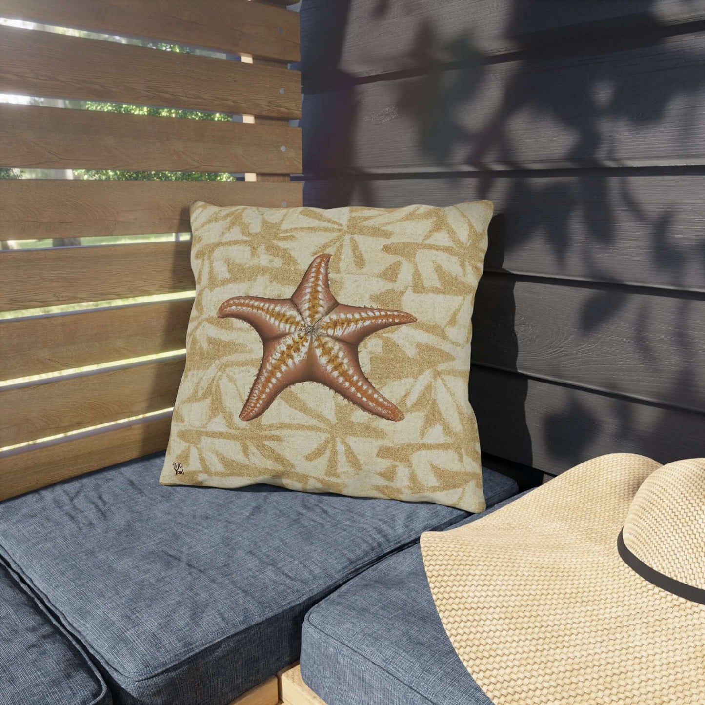 Island Star outdoor throw pillow on patio chair, starfish design, coastal theme inspired