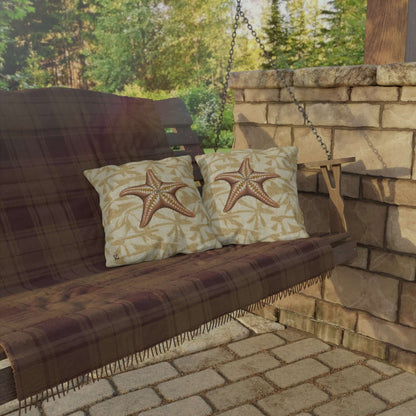 Island Star outdoor throw pillows with starfish design on a wooden swing bench in a serene garden setting.