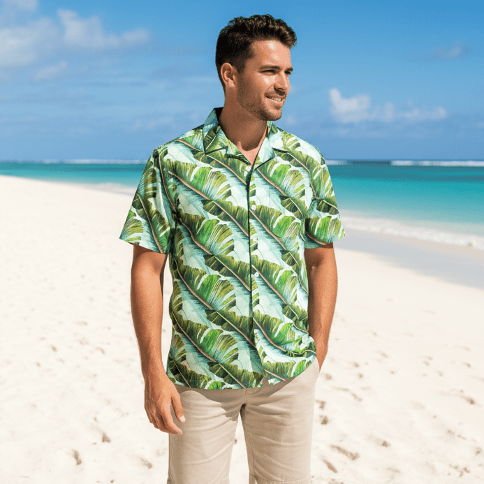 Hilo Harmony shirt lifestyle photo - person wearing shirt on white sand beach with turquoise ocean