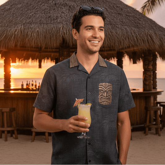 Tiki Mask shirt lifestyle photo - person wearing shirt in front of resort tiki bar at sunset